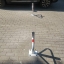 Foldable parking barrier with padlock